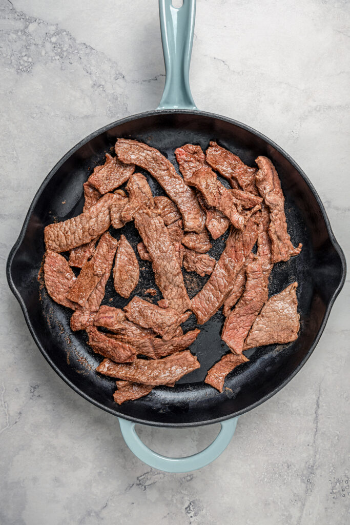 This beef and broccoli recipe with honey, garlic, and red pepper flakes is a spicy, saucy Asian-style dinner that beats take-out any day. Browning the beef.