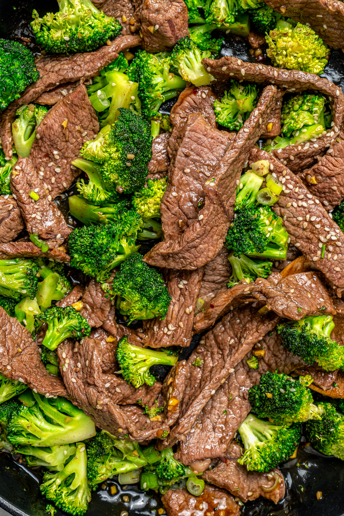 This beef and broccoli recipe with honey, garlic, and red pepper flakes is a spicy, saucy Asian-style dinner that beats take-out any day. Close-up of beef and broccoli recipe.