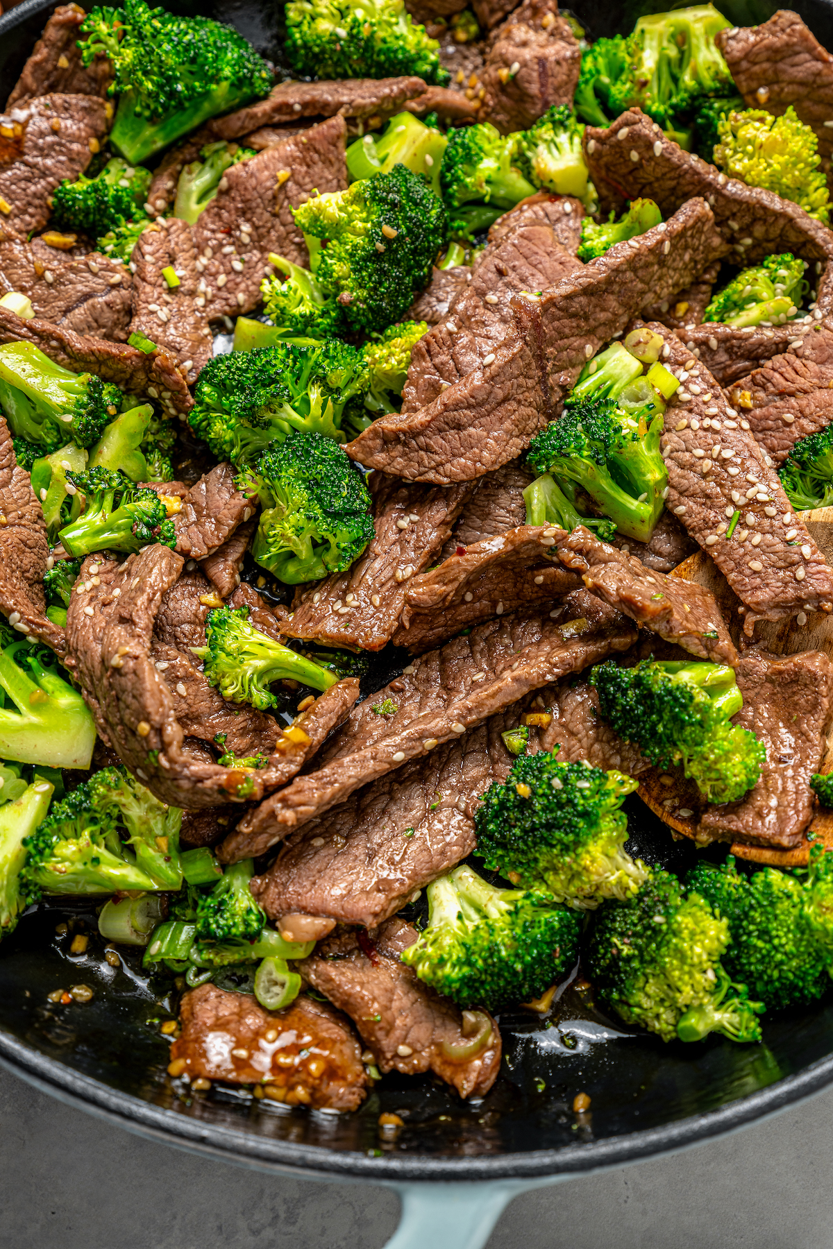 This beef and broccoli recipe with honey, garlic, and red pepper flakes is a spicy, saucy Asian-style dinner that beats take-out any day. Close-up of broccoli beef.
