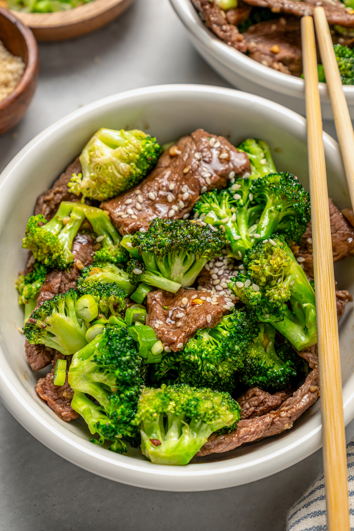 This beef and broccoli recipe with honey, garlic, and red pepper flakes is a spicy, saucy Asian-style dinner that beats take-out any day. Bowl of beef and broccoli recipe.