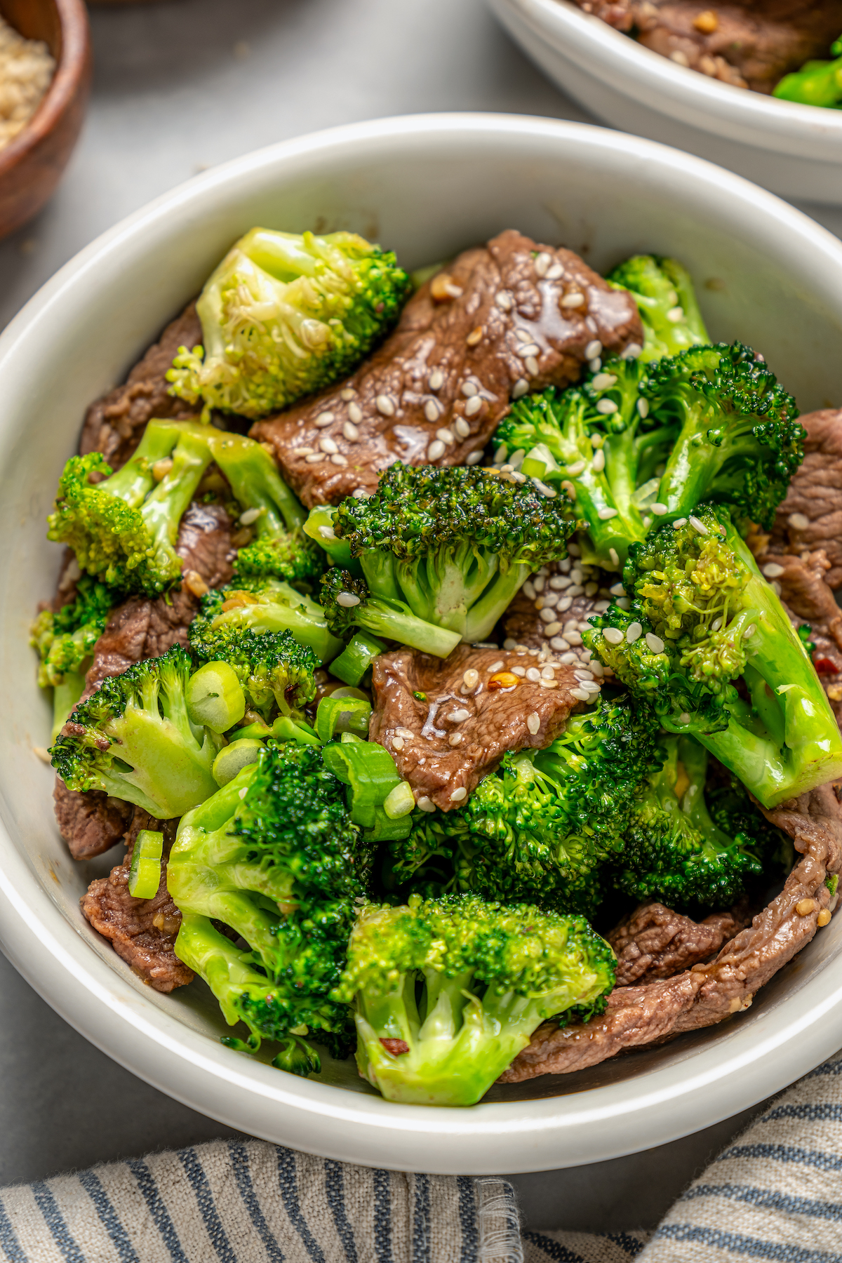 This beef and broccoli recipe with honey, garlic, and red pepper flakes is a spicy, saucy Asian-style dinner that beats take-out any day. Bowl of broccoli beef.