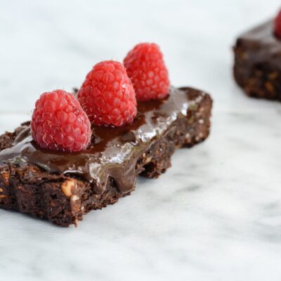 Chocolate Walnut Tart with Raspberries is a triple dose of chocolate that makes this one incredible dessert. I kept the recipe clean, so this tart is gluten free, dairy free and paleo friendly.
