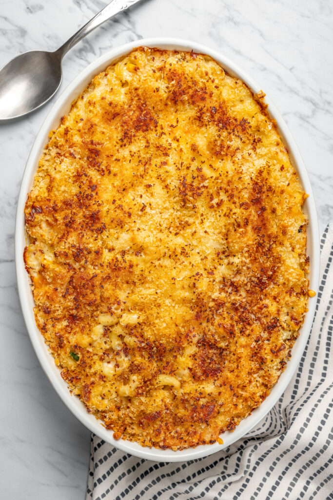 This Creamy Mac and Cheese with Jalapeño and Corn is a little spicy, a little sweet, and very, very cheesy. Irresistible and easy to make! A baked macaroni and cheese casserole.