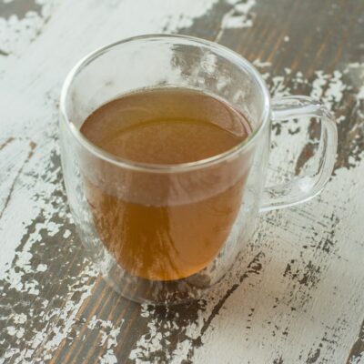 chicken bone broth in a glass mug