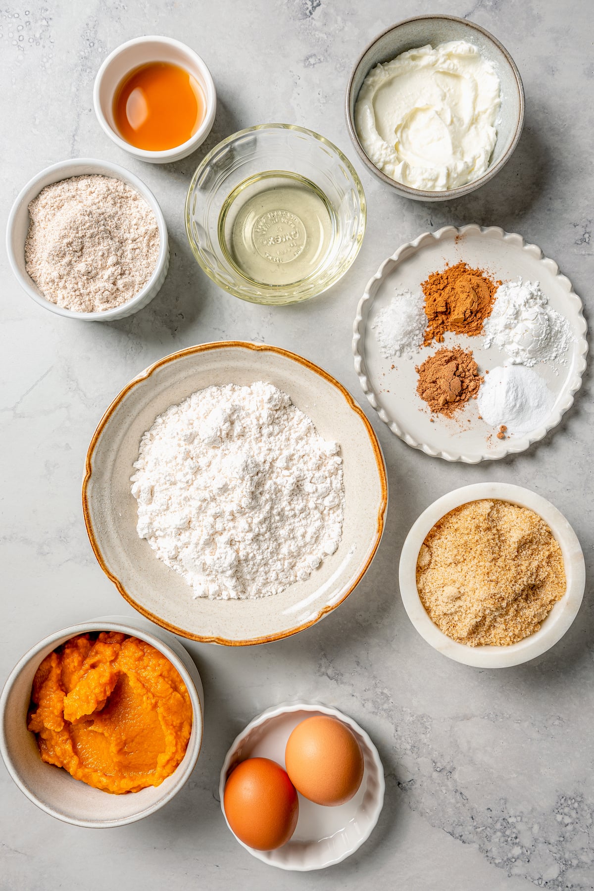 This spiced pumpkin bread recipe with whole-wheat flour, creamy yogurt, and brown sugar is the perfect fall-flavored breakfast. Ingredients for making pumpkin bread.