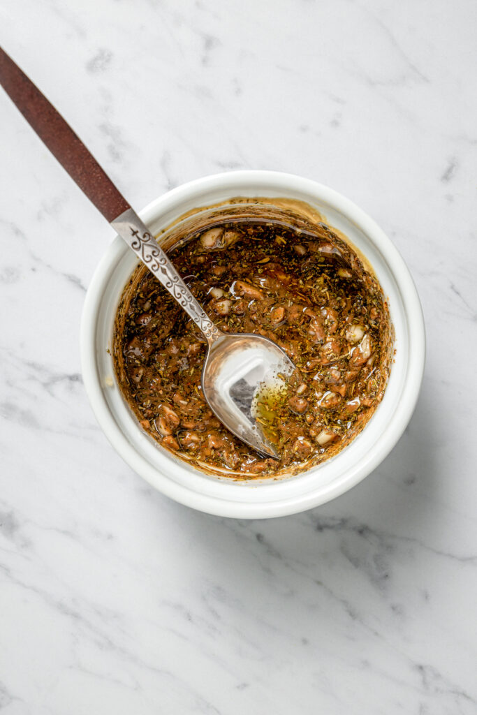 This Pan Seared Steak Recipe with Roasted Vegetables is hearty, filling, and easy to make. A crazy-good marinade brings it all together! A marinade mixture in a small bowl.