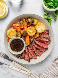 A steak dinner on a white dinner plate.