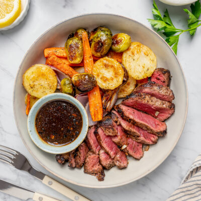 A steak dinner on a white dinner plate.