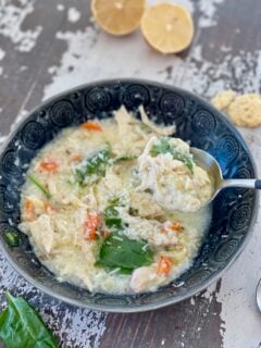 LEMON CHICKEN RICE SOUP in a bowl with spoon