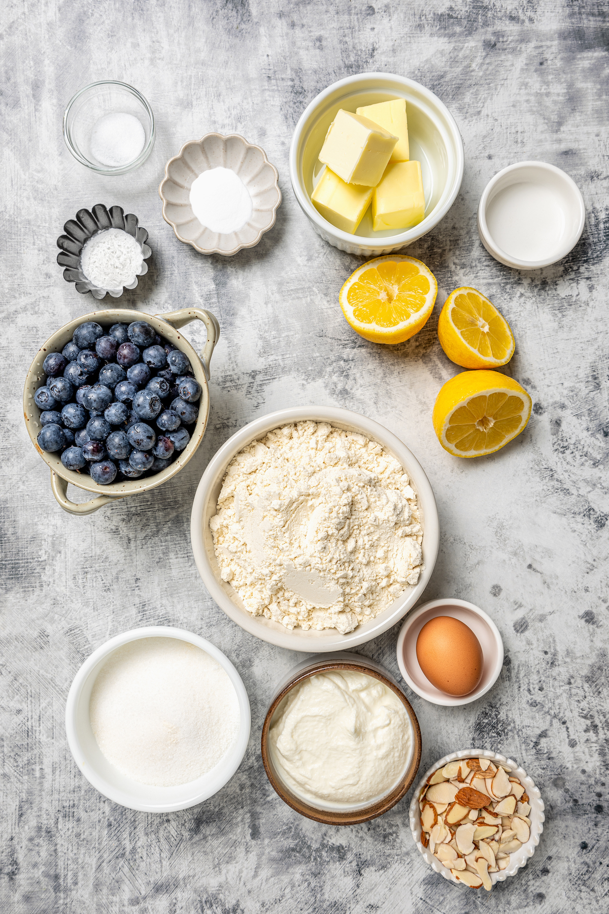 These lemon-blueberry ricotta muffins with crunchy almonds are an easy 20-minute baked treat. They're so light and fluffy you'd never guess they're gluten-free! Add shredded coconut for extra fruity vibes. Ingredients for ricotta muffins.