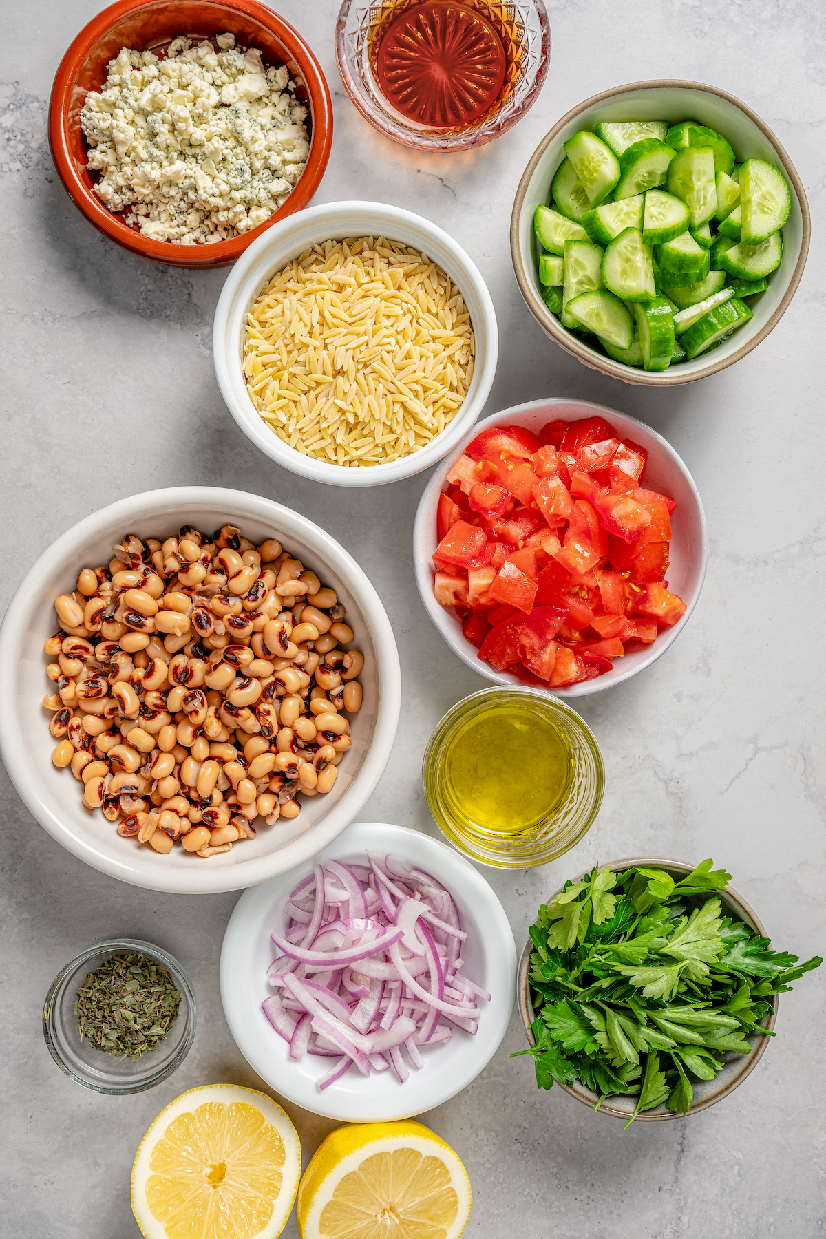 This orzo and black eyed pea salad recipe with crunchy veggies and two homemade vinaigrettes is a refreshing summer side. Ingredients for orzo black-eyed pea salad.