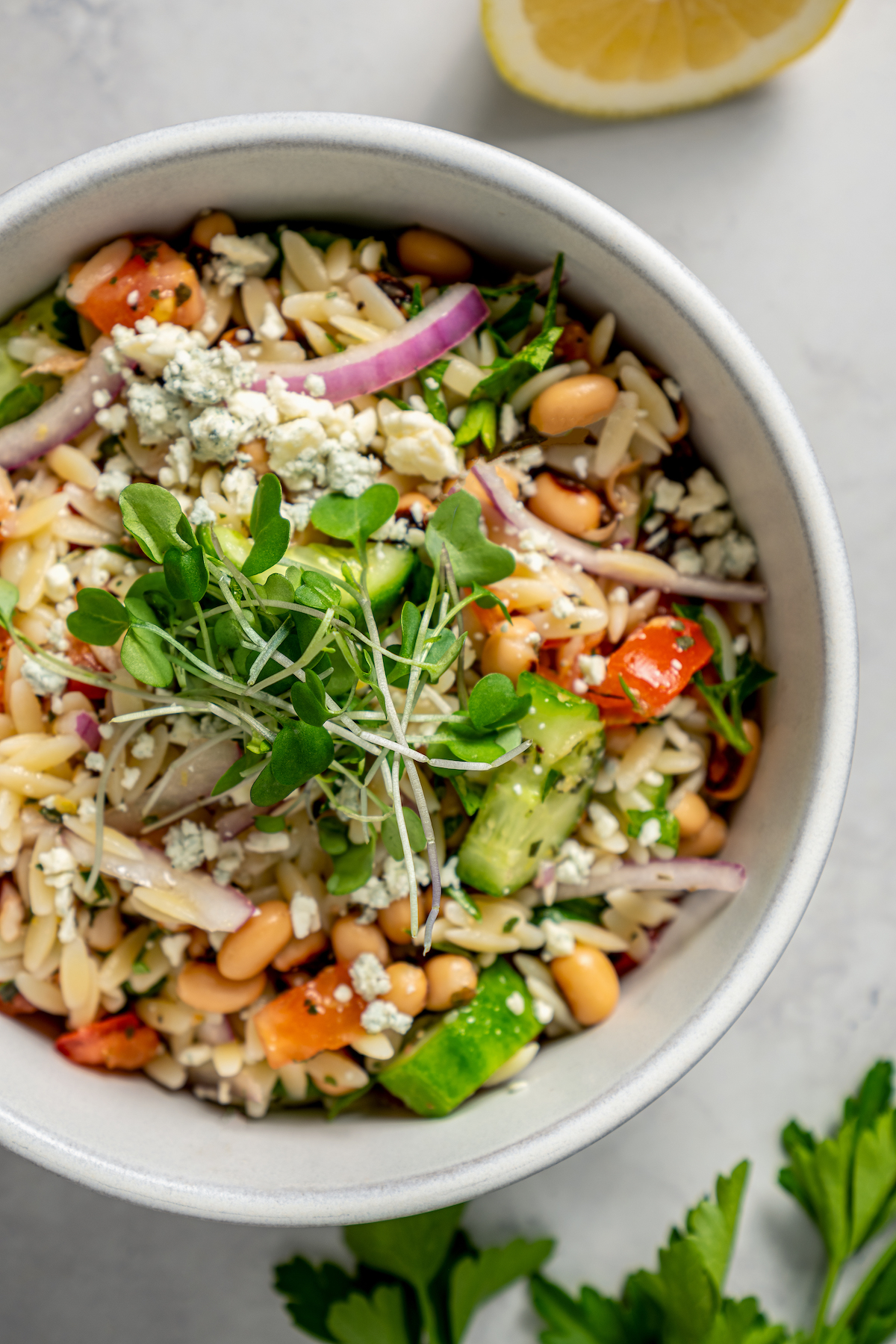 This orzo and black eyed pea salad recipe with crunchy veggies and two homemade vinaigrettes is a refreshing summer side. Mediterranean-style orzo black-eyed pea salad with blue cheese.