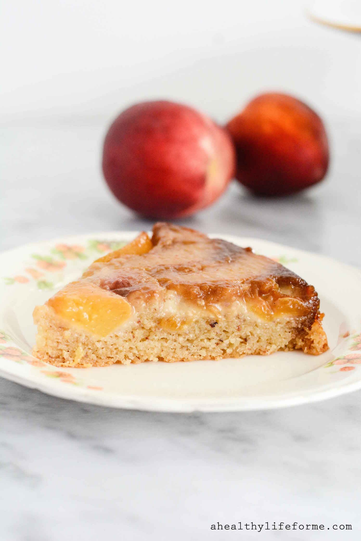 A slice of tender peach upside down cake. 