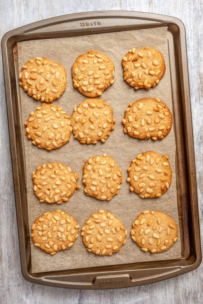 Italian Pignoli Cookies are crispy, chewy and almond-y, topped with rich, creamy pine nuts. They're sure to become a family favorite! Bake pignoli on a cookie sheet.