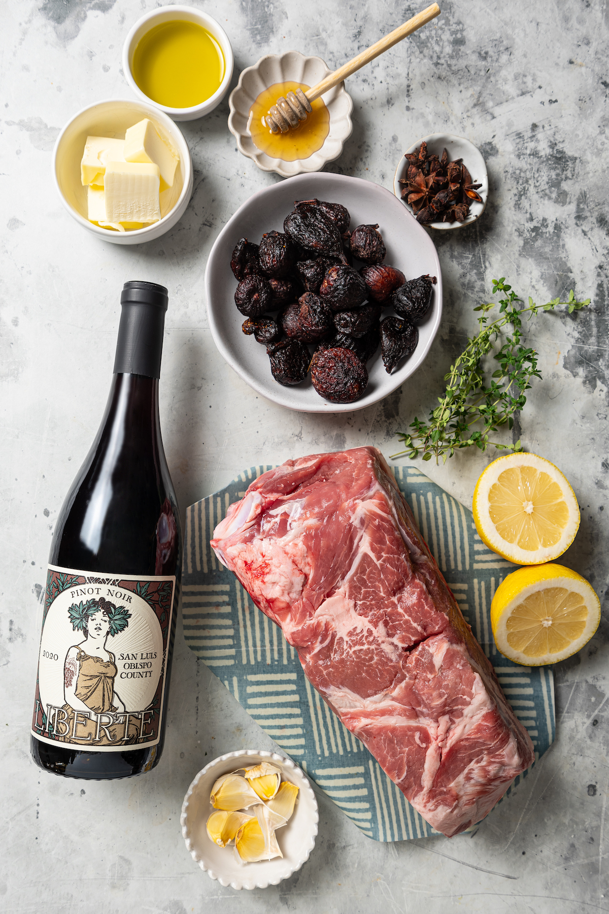This sweet-and-savory pork shoulder recipe with honey, red wine-fig sauce, and lots of fruity figs is perfect for Thanksgiving dinners. Ingredients for making the roasted pork shoulder recipe with fig sauce.