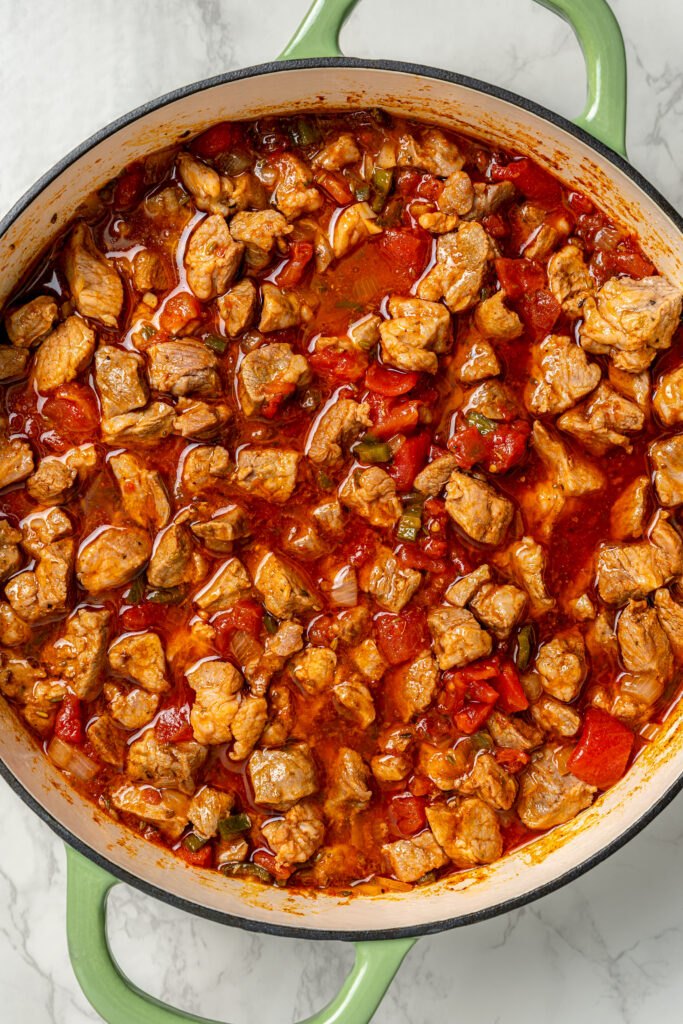 Cooked pork in the tomatoey sauce mixture