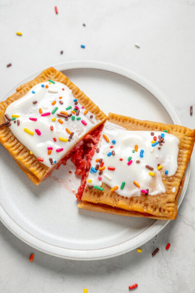 Protein pop tarts with frosting cut in half.