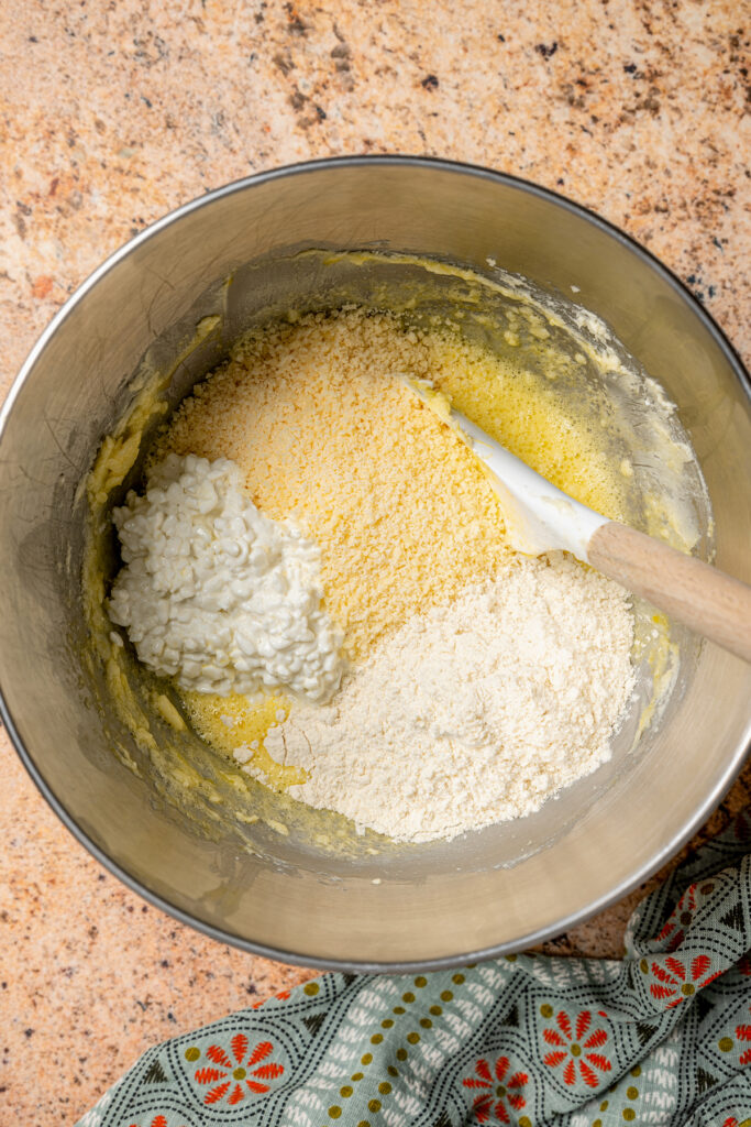 This buttery breakfast muffins recipe is packed with creamy cottage cheese and parmesan for a tender bite. Adding the dry mixture into the creamed butter.