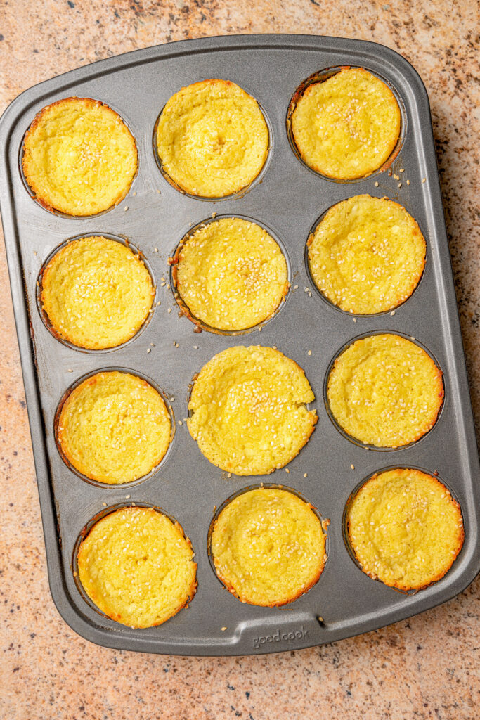 This buttery breakfast muffins recipe is packed with creamy cottage cheese and parmesan for a tender bite. Baked muffins in the tray.