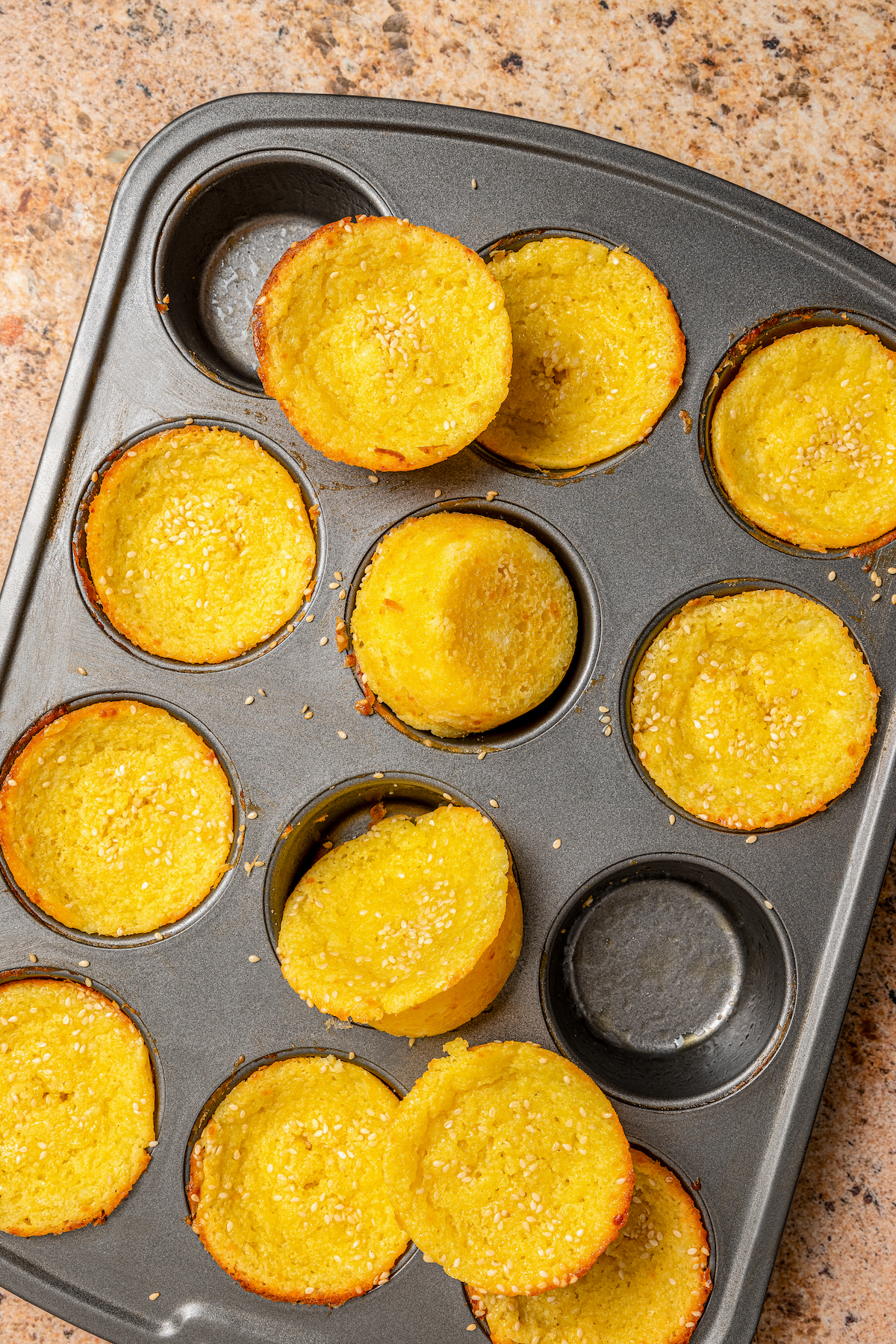 This buttery breakfast muffins recipe is packed with creamy cottage cheese and parmesan for a tender bite. Baked quesadilla breakfast muffins with golden edges and crunchy sesame seeds.