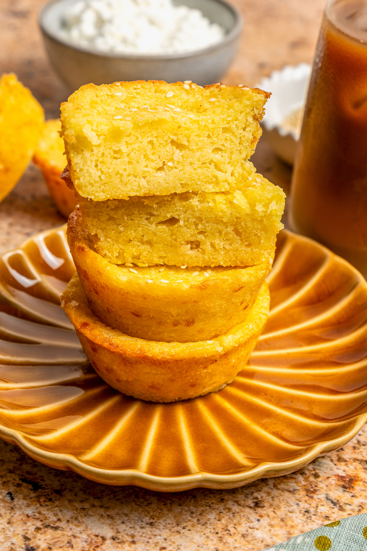 This buttery breakfast muffins recipe is packed with creamy cottage cheese and parmesan for a tender bite. Stack of Salvadoran breakfast muffins.