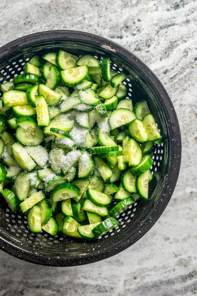 This easy cucumber kimchi recipe with gochugaru pepper and tangy fish sauce is the fastest way to put Korean kimchi on the table for dinner. Salting the cucumbers.