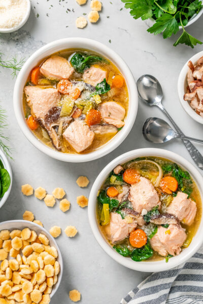 Poached salmon soup in bowls.
