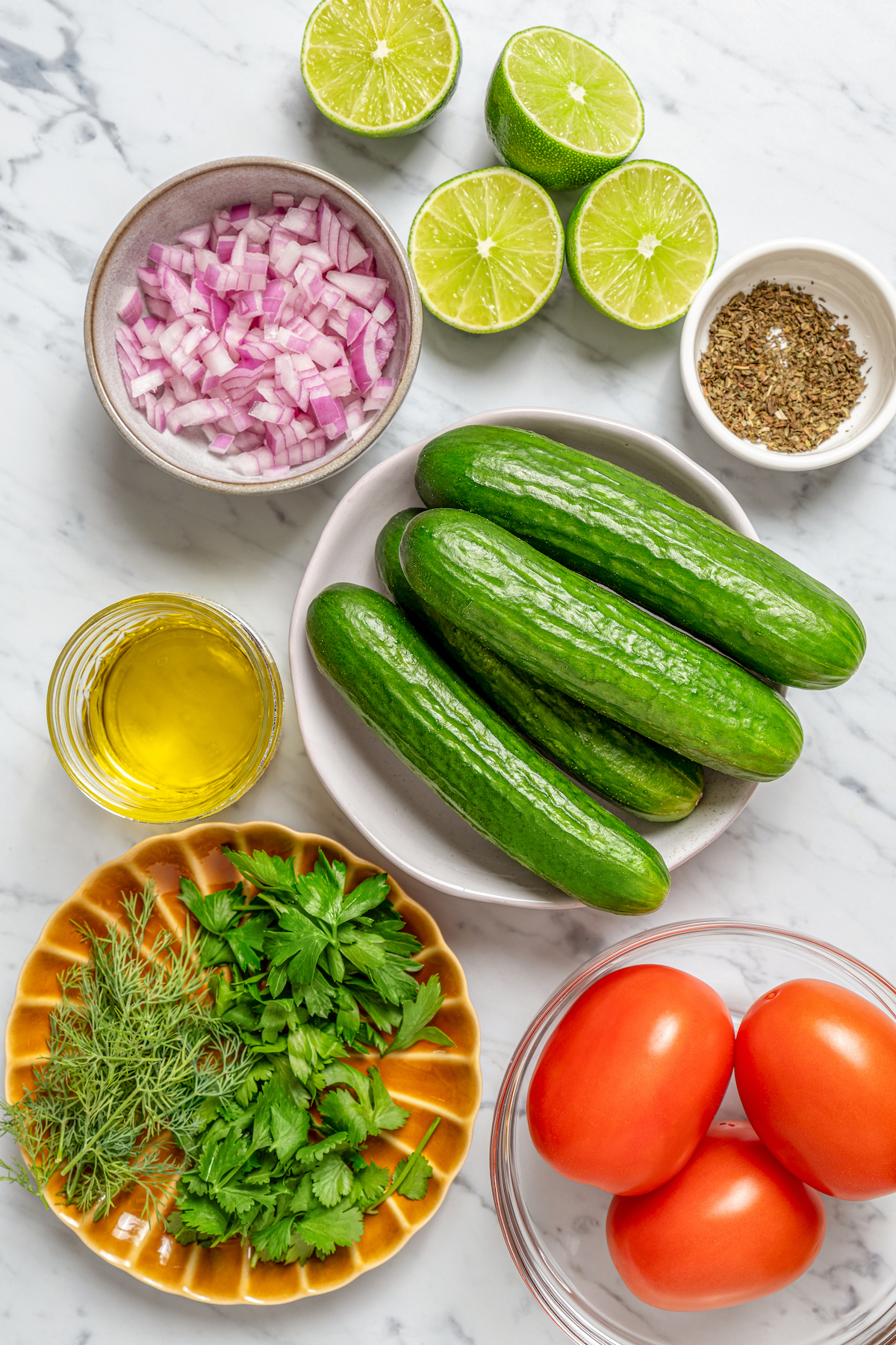 This quick shirazi salad with cucumbers, tomatoes, red onions, and a light vinaigrette is a refreshing Middle Eastern side you'll love. Ingredients for shirazi salad.
