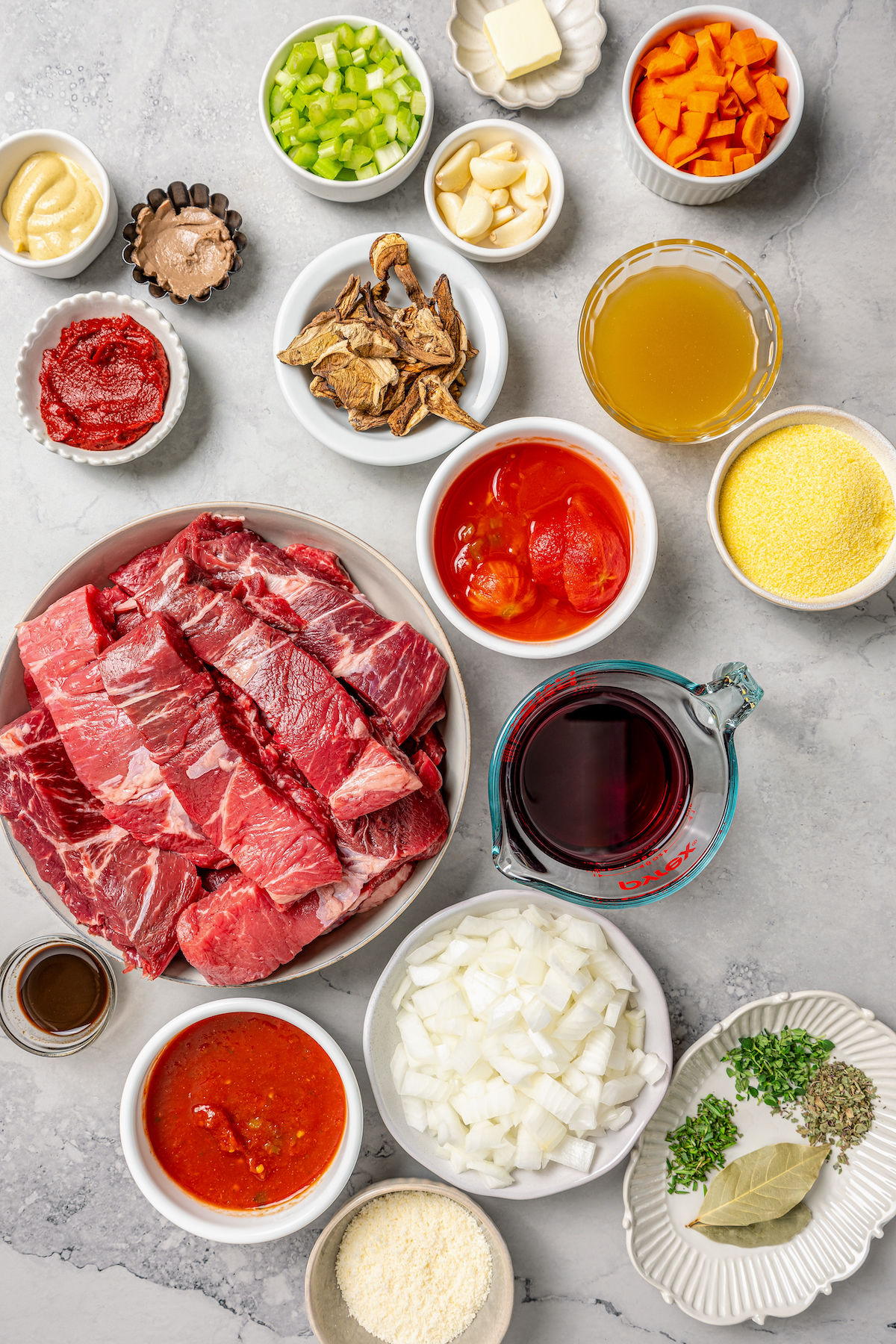 This garlicky slow cooker short ribs recipe with red wine, tender veggies, and dried herbs is an easy but fancy dinner. Ingredients for slow cooker short ribs.