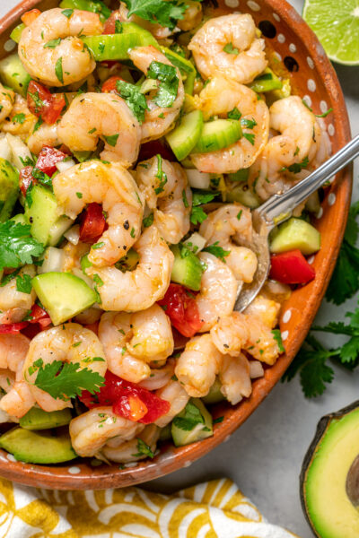 A salad dish full of cold shrimp salad.