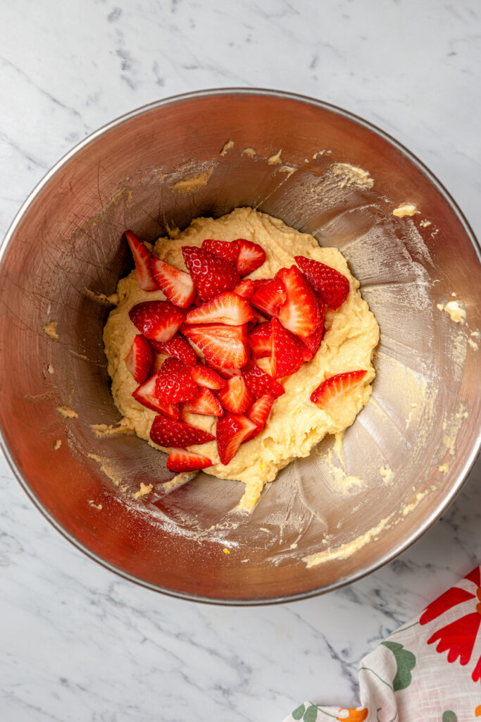 This fluffy, sour cream-strawberry bread recipe with sweet maple syrup is an easy breakfast option with your favorite coffee. Adding the strawberries to the batter.