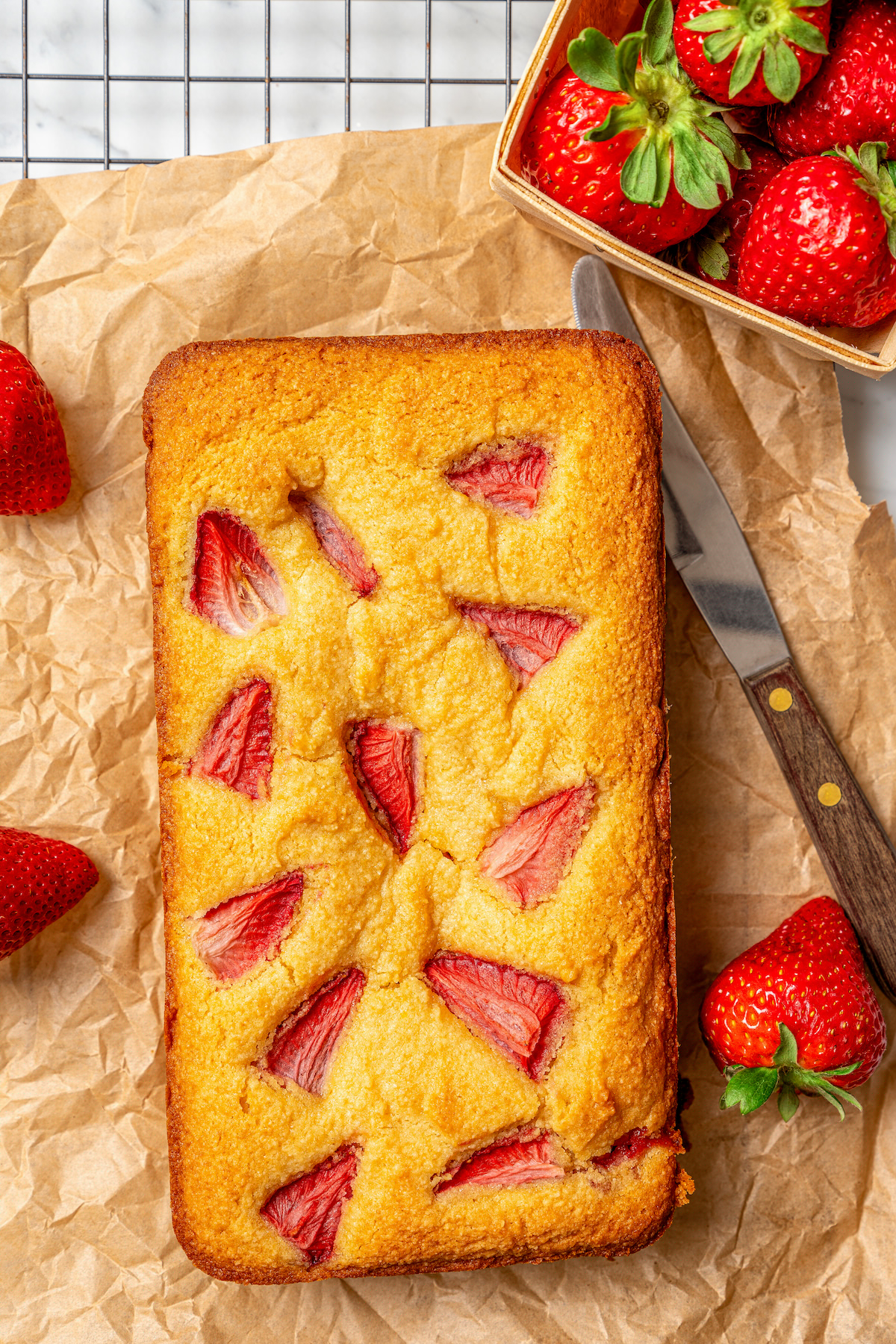 This fluffy, sour cream-strawberry bread recipe with sweet maple syrup is an easy breakfast option with your favorite coffee. Freshly-baked strawberry bread with golden edges.