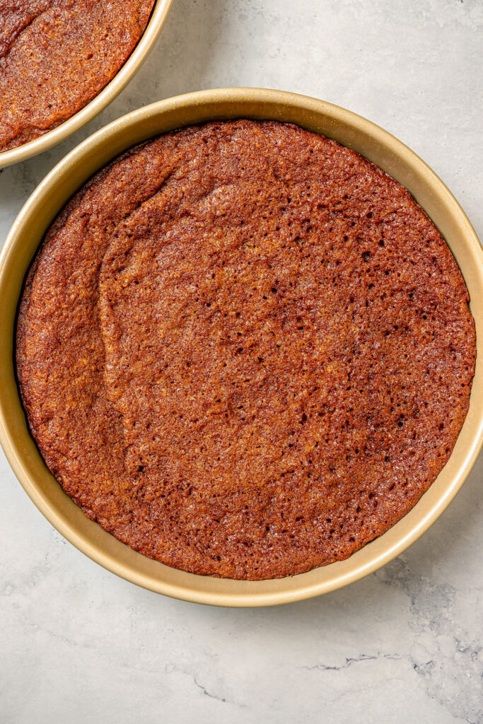 This fluffy strawberry cake recipe with homemade chocolate-maple frosting is an easy but impressive Valentine's Day dessert. Baked cake in its pan.