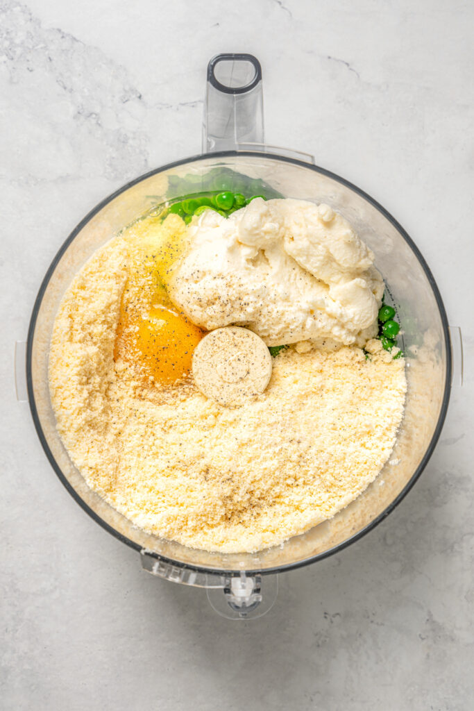 Cheese Ravioli with Peas and Butter Sauce will soon become one of your family's favorites. Easy to make with wonton wrappers! Ricotta, parmesan, peas, and other ingredients in a food processor.